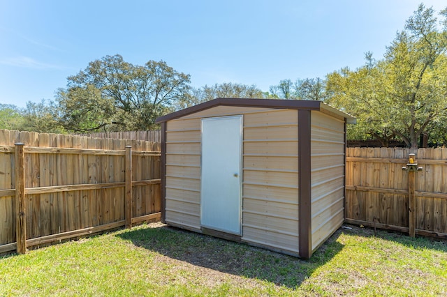view of shed with a fenced backyard