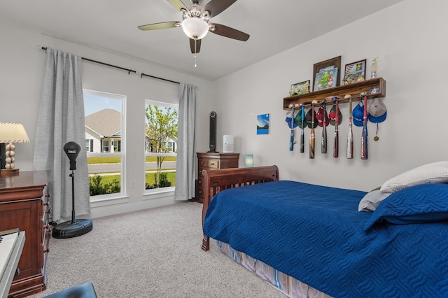 carpeted bedroom with ceiling fan