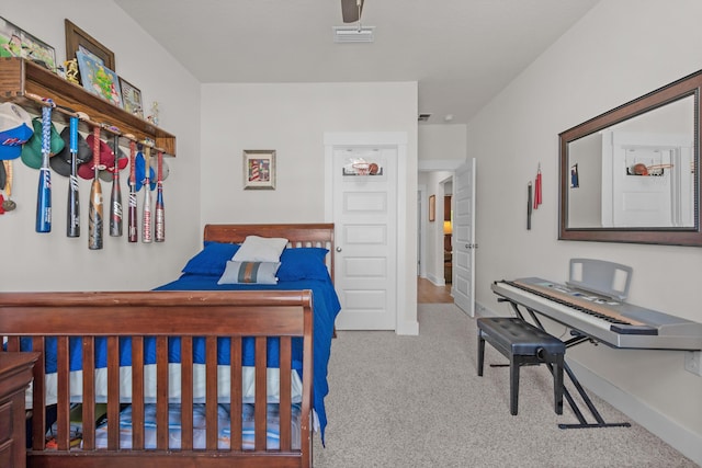 bedroom featuring visible vents, carpet flooring, and baseboards
