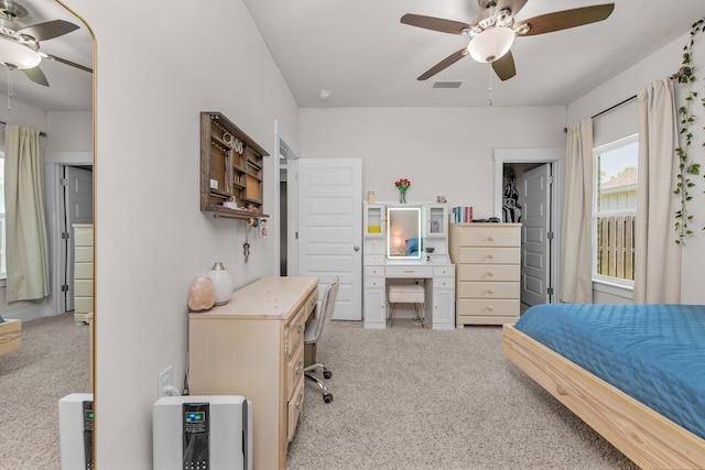 carpeted bedroom with visible vents and ceiling fan