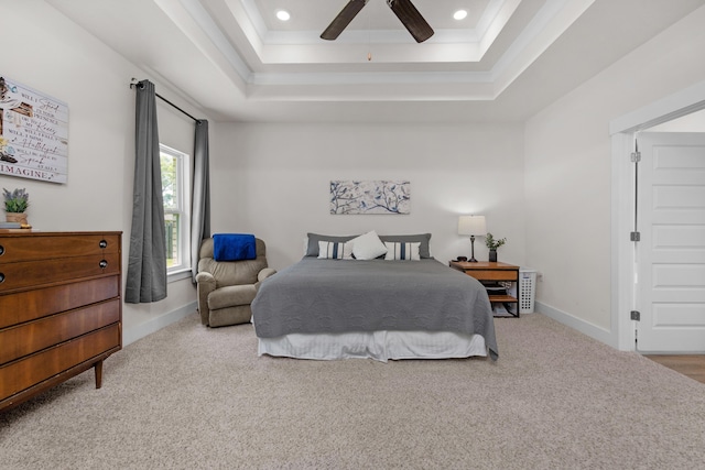 bedroom featuring baseboards, carpet flooring, recessed lighting, and a raised ceiling