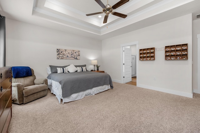 carpeted bedroom with baseboards, visible vents, recessed lighting, a ceiling fan, and a raised ceiling