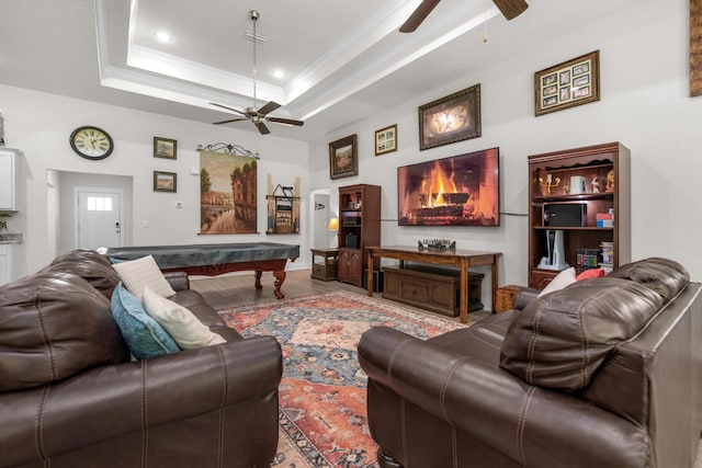 living area with wood finished floors, a ceiling fan, pool table, and ornamental molding