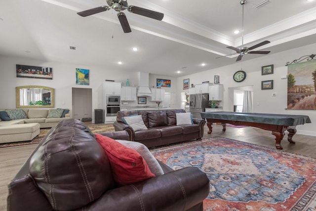 living room featuring ceiling fan, recessed lighting, visible vents, and light wood-type flooring
