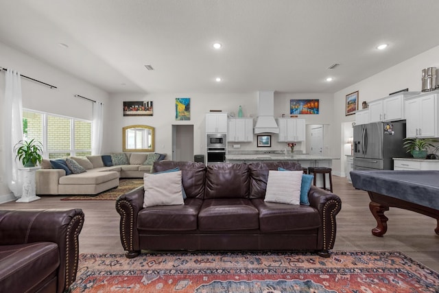 living room with recessed lighting, wood finished floors, visible vents, and pool table