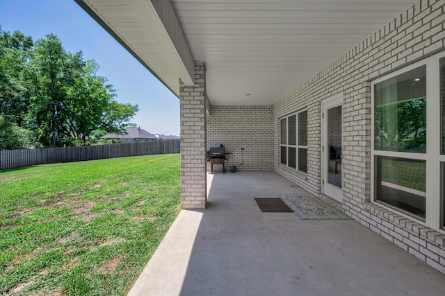 view of patio / terrace featuring fence and grilling area