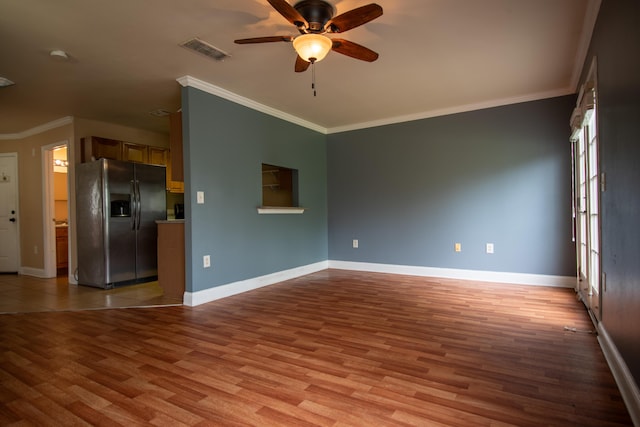 unfurnished living room featuring light wood-style flooring, visible vents, ceiling fan, and baseboards