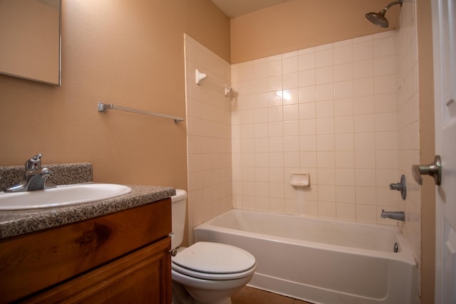 bathroom with vanity, toilet, and tub / shower combination