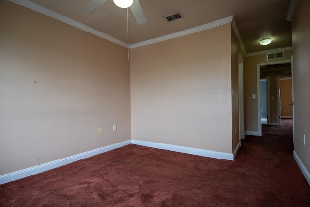 carpeted empty room with crown molding, a ceiling fan, and visible vents