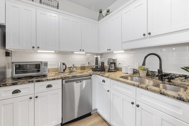 25 S Wildflower Dr Unit 224, Santa Rosa Beach, FL 32459 - kitchen featuring backsplash, a sink, stainless steel dishwasher, a toaster, and white cabinets