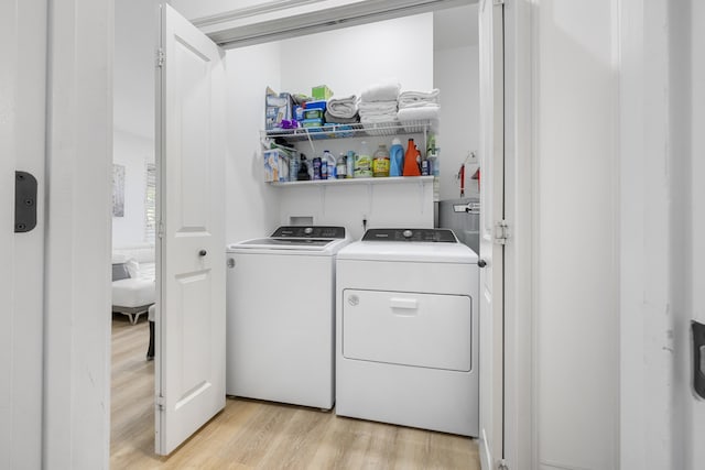 25 S Wildflower Dr Unit 224, Santa Rosa Beach, FL 32459 - laundry area with light wood-type flooring, washing machine and clothes dryer, and laundry area