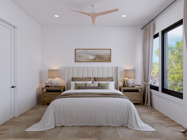 bedroom with light carpet, ceiling fan, and recessed lighting