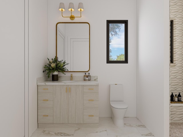 bathroom featuring marble finish floor, vanity, and toilet