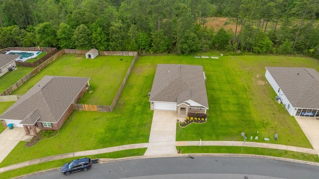 drone / aerial view with a view of trees