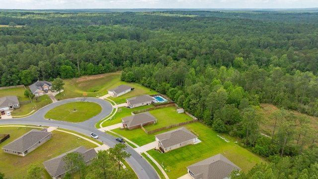 aerial view featuring a view of trees and a residential view