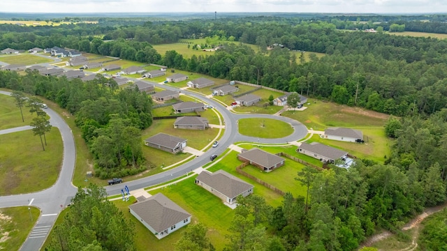 bird's eye view featuring a residential view and a forest view