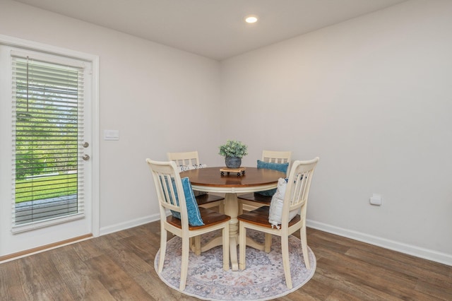 dining room with baseboards, recessed lighting, and wood finished floors