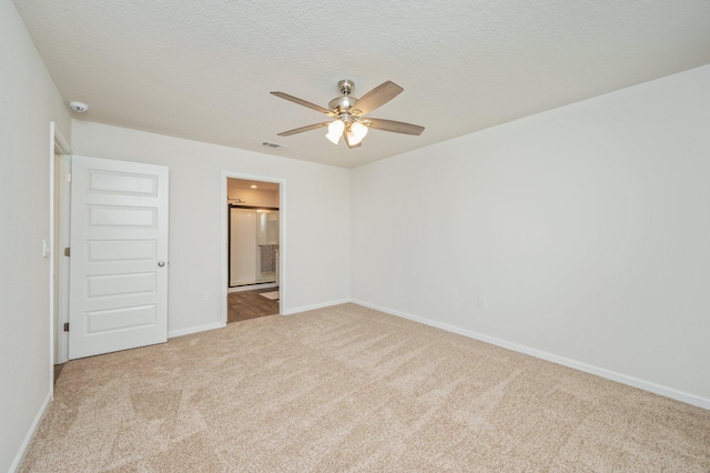 3060 Brandon Dunes Ln, Laurel Hill, FL 32567 - unfurnished bedroom with carpet flooring, baseboards, ensuite bathroom, a textured ceiling, and a ceiling fan
