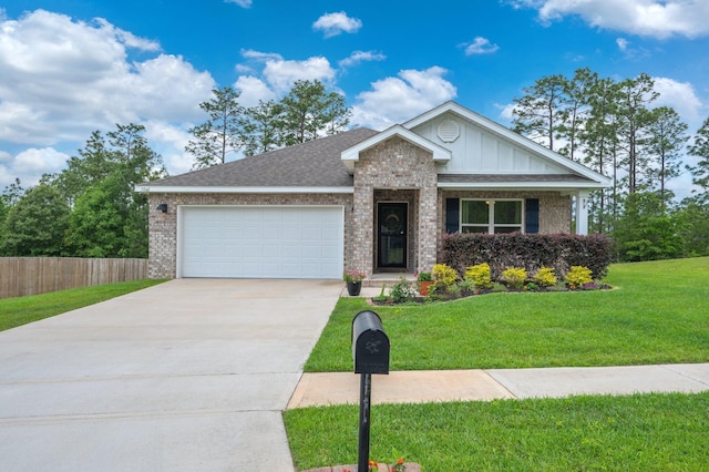 ranch-style house with fence, an attached garage, brick siding, board and batten siding, and a front yard
