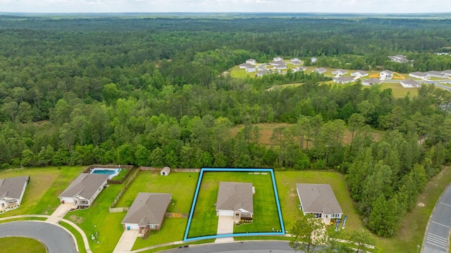 3060 Brandon Dunes Ln, Laurel Hill, FL 32567 - aerial view of residential area featuring a forest and property parcel outlined