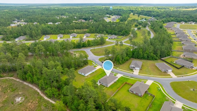 3060 Brandon Dunes Ln, Laurel Hill, FL 32567 - aerial perspective of suburban area with a heavily wooded area