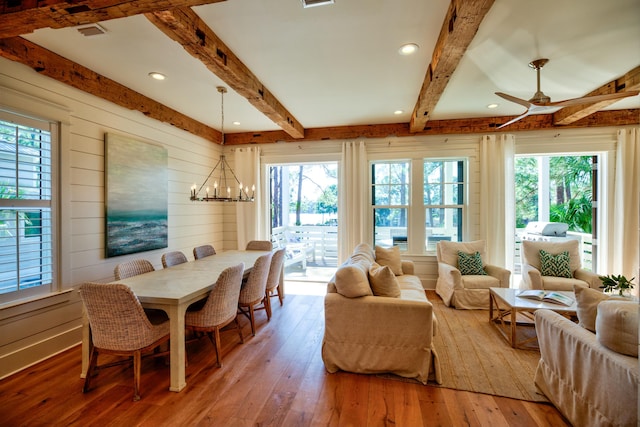 dining area with recessed lighting, beam ceiling, wood-type flooring, and ceiling fan with notable chandelier