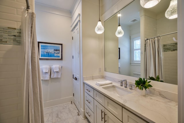 bathroom with toilet, visible vents, baseboards, marble finish floor, and vanity