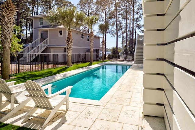 view of pool with a patio area, fence, and a fenced in pool