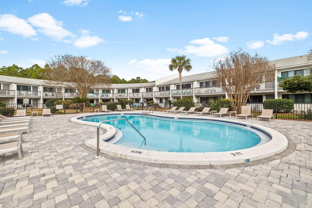 3605 E County Highway 30a Unit 236, Santa Rosa Beach, FL 32459 - community pool with a residential view, fence, and a patio