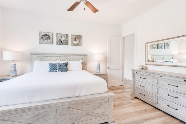 bedroom with light wood-style flooring and ceiling fan