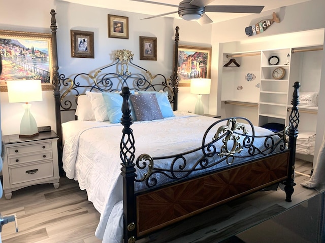 bedroom featuring wood finished floors and a ceiling fan