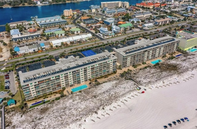 drone / aerial view featuring a water view and a view of city