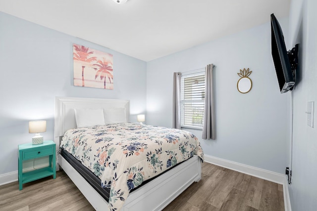 9860 S Thomas Dr Unit 501, Panama City Beach, FL 32408 - bedroom with light wood finished floors and baseboards