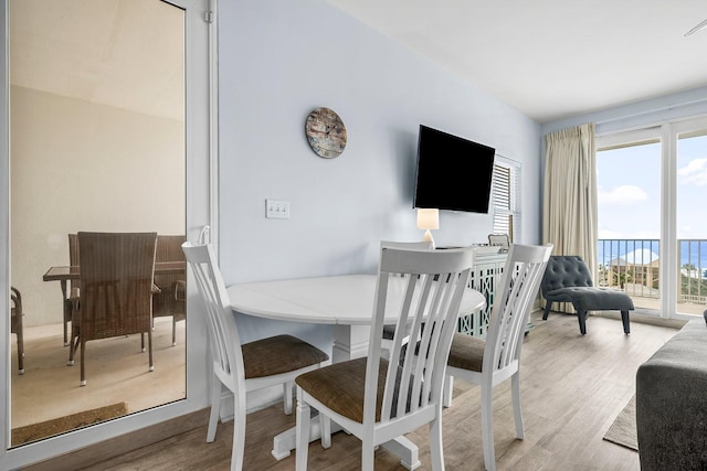 9860 S Thomas Dr Unit 501, Panama City Beach, FL 32408 - dining area with visible vents and wood finished floors