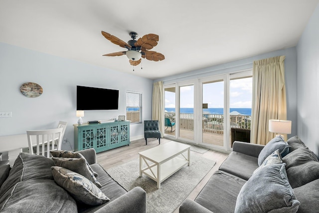 9860 S Thomas Dr Unit 501, Panama City Beach, FL 32408 - living area with baseboards, light wood-style flooring, and a ceiling fan