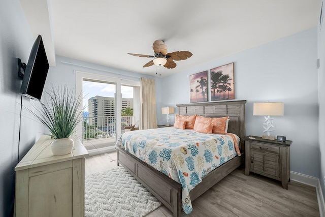 9860 S Thomas Dr Unit 501, Panama City Beach, FL 32408 - bedroom with a ceiling fan, baseboards, access to exterior, and light wood finished floors