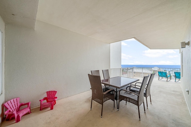 9860 S Thomas Dr Unit 501, Panama City Beach, FL 32408 - view of patio / terrace featuring outdoor dining space and a water view