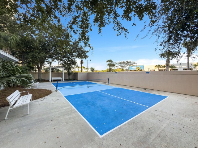 9860 S Thomas Dr Unit 501, Panama City Beach, FL 32408 - view of tennis court featuring fence