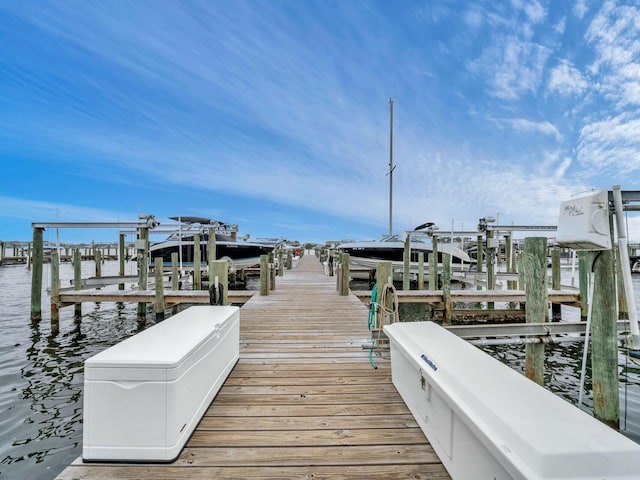 view of dock featuring boat lift and a water view