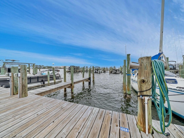 view of dock with a water view and boat lift