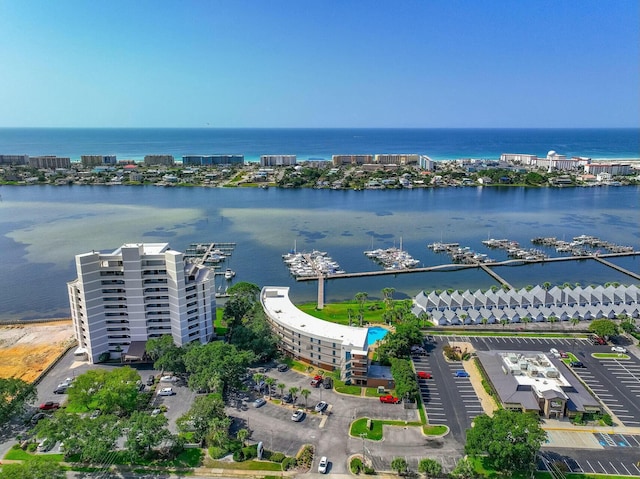 birds eye view of property with a water view