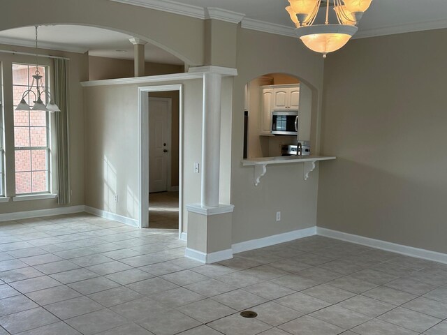 287 Stahlman Ave, Destin, FL 32541 - unfurnished room with crown molding, baseboards, and arched walkways