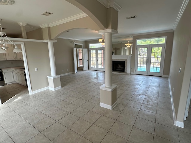 287 Stahlman Ave, Destin, FL 32541 - unfurnished living room with decorative columns, french doors, and visible vents