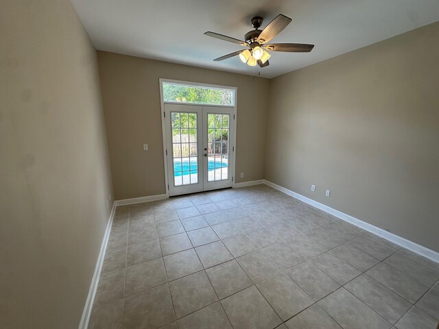 287 Stahlman Ave, Destin, FL 32541 - tiled empty room with french doors, ceiling fan, and baseboards