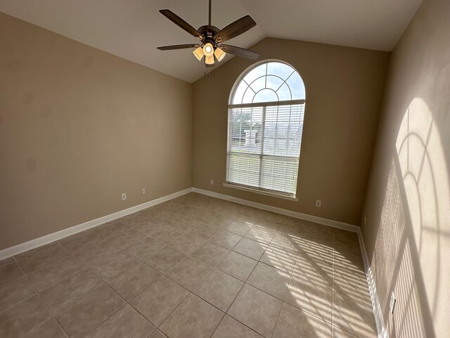 287 Stahlman Ave, Destin, FL 32541 - spare room featuring ceiling fan, vaulted ceiling, tile patterned flooring, and baseboards