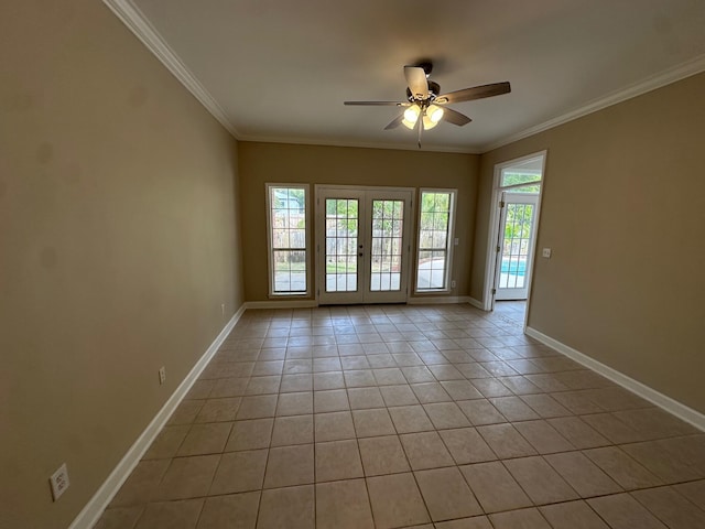 287 Stahlman Ave, Destin, FL 32541 - unfurnished room with baseboards, light tile patterned floors, french doors, a ceiling fan, and crown molding