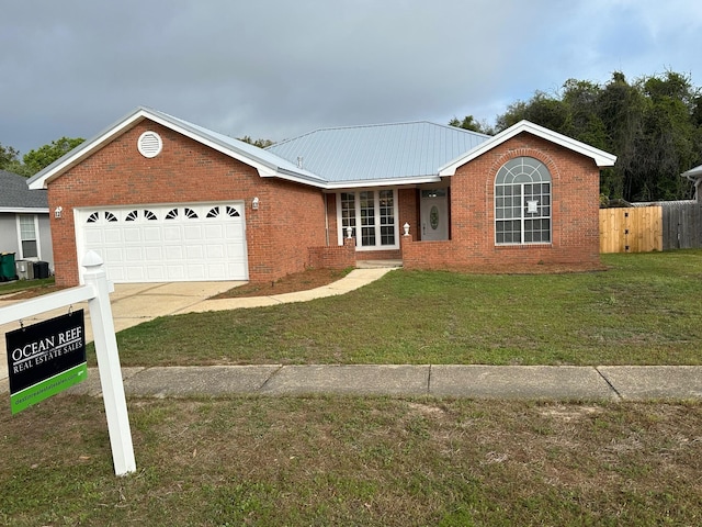 287 Stahlman Ave, Destin, FL 32541 - single story home with a garage, a front yard, fence, brick siding, and driveway