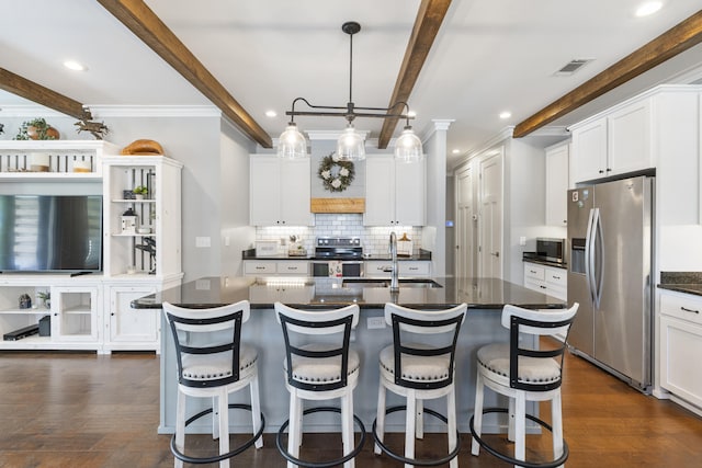 862 Bay Grove Rd, Freeport, FL 32439 - kitchen with dark wood-style floors, a sink, beam ceiling, decorative backsplash, and appliances with stainless steel finishes