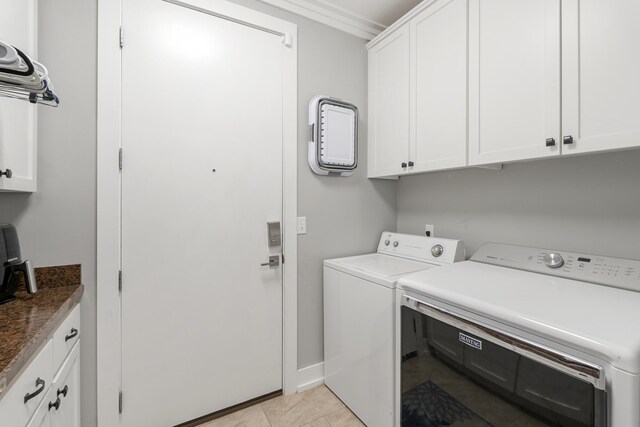 862 Bay Grove Rd, Freeport, FL 32439 - clothes washing area featuring separate washer and dryer, baseboards, cabinet space, and light tile patterned floors
