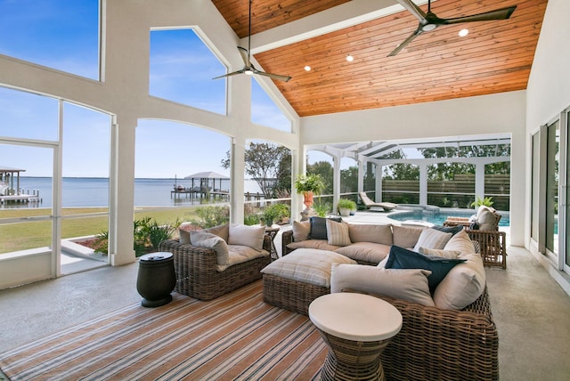 sunroom / solarium featuring outdoor lounge area, a water view, and a ceiling fan